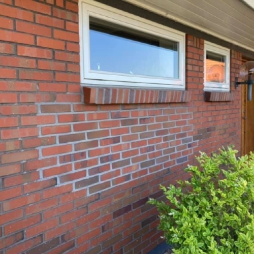 Facaderenovering med ny omfugning på murstenshus i Varde